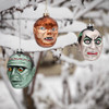 Monster movie ornaments in the snow