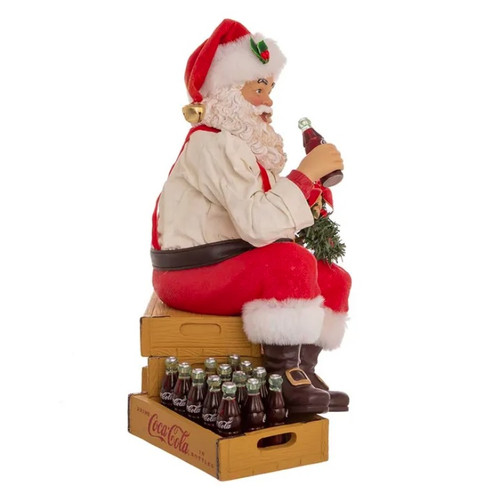 Coca-Cola Fabriche Santa Sitting on Crates - Side View Coca-Cola Fabriche Santa Sitting on Crates - Side View