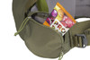 Close up of Kelty Journey PerfectFIT Elite child carrier backpack, showing snacks stored in zippered waistbelt pocket
