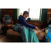 Woman sitting while inside Kelty Women's Mistral 20 sleeping bag