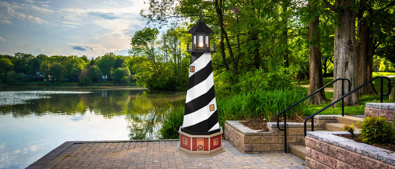 Amish handcrafted PVC garden lighthouse on riverfront patio