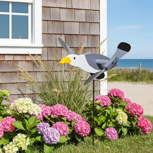 Amish handcrafted lawn decor whirlygig garden stake - Seagull, in flower bed at beach house