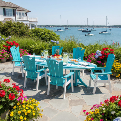 Surf-Aira Amish crafted poly dining table & Ocean Wavz chairs in aruba blue and white. Pictured on a stone waterfront patio.