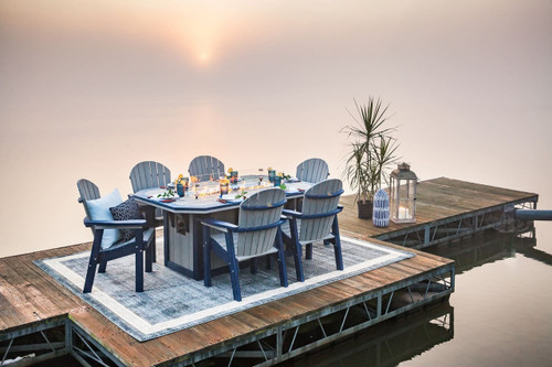 SummerSide poly dining height fire table by Finch, pictured on a dock