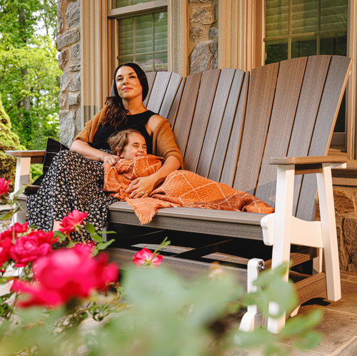 Amish crafted triple glider with center console, pictured on porch.