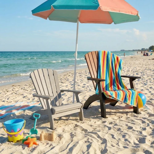 All-weather poly child size adirondack chair in childs size, pictured in light gray on a beach setting with sand toys and umbrella.