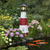 Amish crafted poly garden lighthouse, Montauk, NY model, in black, cherrywood, white, pictured by a koi pond.