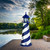 Amish made Cape Hatteras style wood garden lighthouse pictured on a river front patio, finished in patriot blue and white