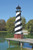 Cape Hatteras replica AZEK® PVC garden lighthouse, 12 foot with base, pictured on dock at lake.