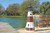 Amish crafted Montauk replica poly garden lighthouse on lakeshore.