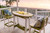 Surf Aira poly outdoor furniture  table and chair set pictured at beach, lime green and white.