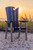 Amish crafted Ocean Wavz collection poly dining chair pictured in patriot blue and light gray, on beach at sunset.