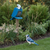 Blue jay shaped wood bird feeder, amish made in the USA. Pictured in a summer flower bed.