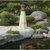 Amish crafted Cape May replica wood garden lighthouse pictured beside a koi pond