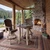 All-weather poly bar chair with swivel seat, amish crafted in birchwood and brazilian walnut. Pictured on a log lodge porch.