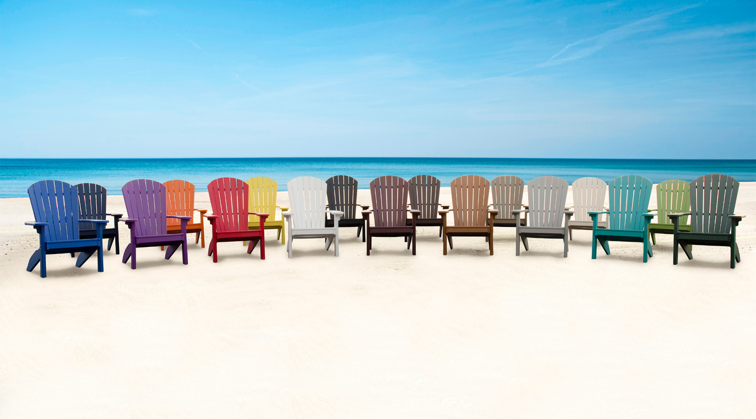 17 colors of adirondack chairs lined up on a beach