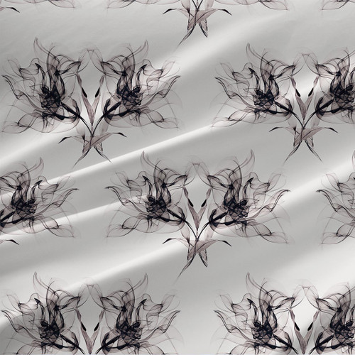 Migration floral fabric in Ink colorway with smoky black botanical blooms on a soft gray ground.