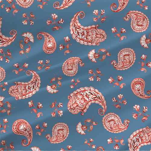 Hazelyine fabric in Denim with red and ivory paisley motifs on a muted denim blue background