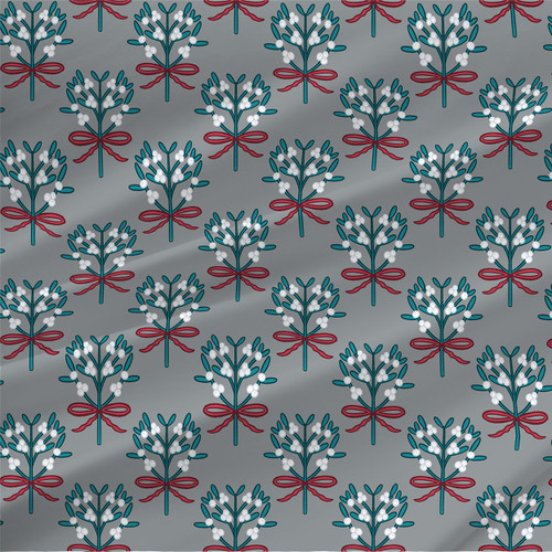 Mistletoe Christmas fabric in Cranberry Frost with teal leaves, white berries, and cranberry red bows on a gray background.