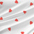 Delight Grande Lipstick Reverse heart fabric with red hearts on a soft white background.