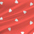 Delight Grande Lipstick heart fabric with white hearts on a bright red background.