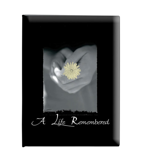 Faded Yellow Flower Held on Black Register Book