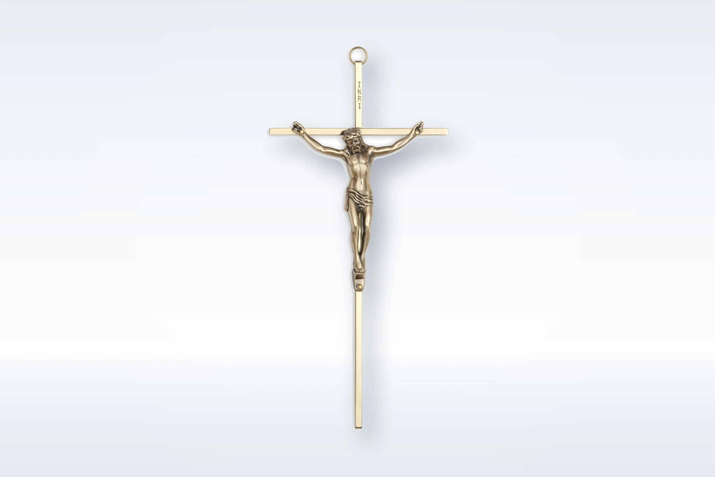 A brass wall crucifix from the Turner Memorial service items range