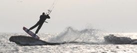kitesurfing off a small ice kicker