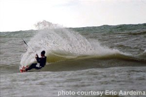 Eric kiteboarding on a wave