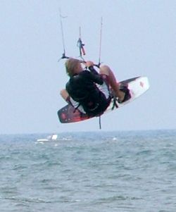 Hands toward the center of the bar and knees tucked