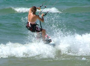 Lisa Moss punching out through a wave
