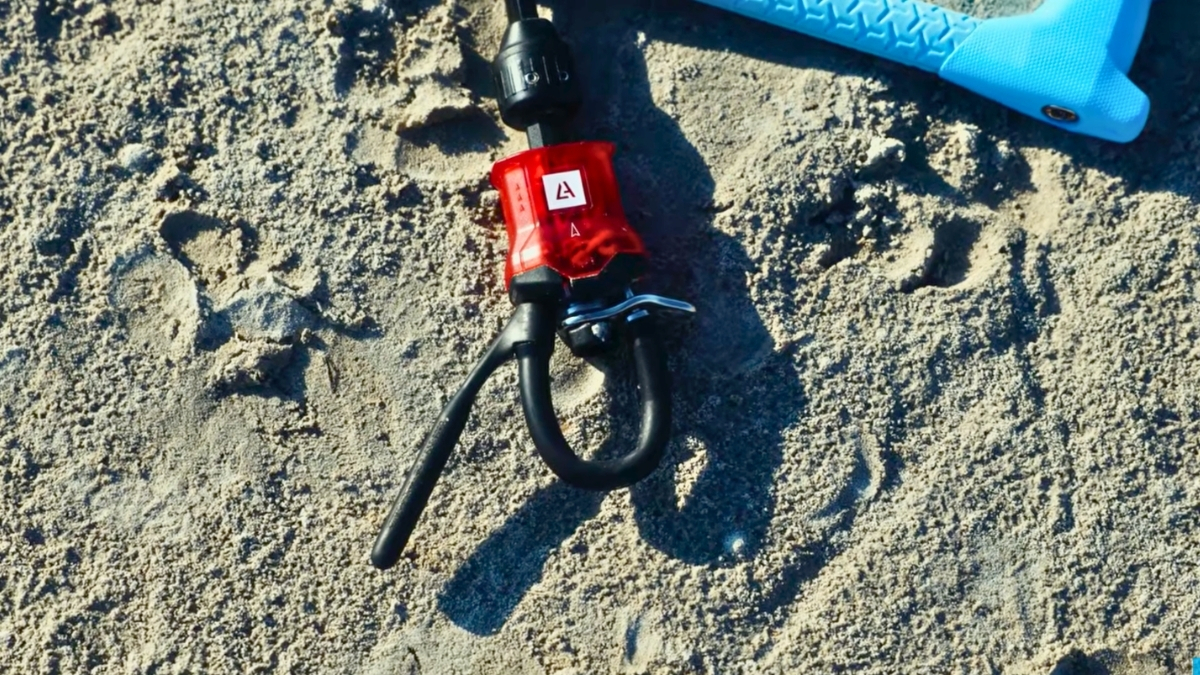 kiteboarding bar safety release laying on the beach