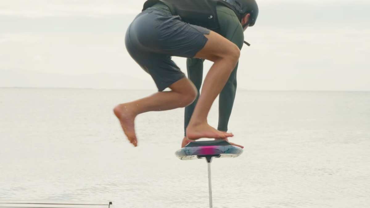 Pump foiler landing back foot first on a foil board during a dockstart jump