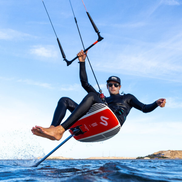 Riding seated on the Slingshot One-Lock Kite Quickstart Package