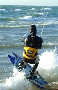 Breaking through the surf with a Liquid Force Picklefork kiteboard Breaking through the surf with a Liquid Force Picklefork kiteboard
