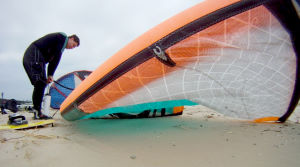 Jake pumping up a larger kiteboarding kite