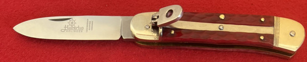 Hubertus Red Jigged Bone Lever Lock Automatic Knife