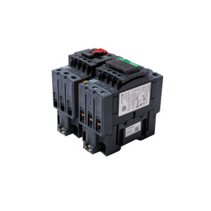 Front perspective view of the Schneider Electric LC2D65AG7 TeSys D 65A reversing contactor assembly, featuring two mechanically interlocked contactors with screw terminals and TeSys branding.