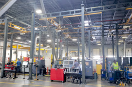 Workstation cranes in manufacturing plant