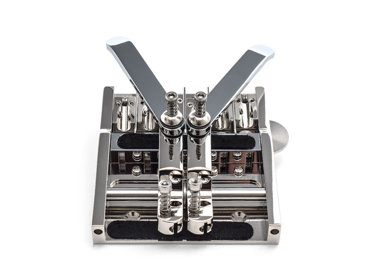 The Duesenberg Multibender - Pedal Steel tones for your electric guitar.

The Multibender is our solution for creating realistic Pedal Steel tones on a regular Electric Guitar.
It features individually adjustable saddles and two levers which can raise or lower the pitch of the string for up to two half-steps on a full press depending on how you set it up. String guidance is friction-free with our roller system, allowing the tuning to remain perfect. The levers are commonly used on the G and B string but can be set up for any of the strings. Also, you can add more levers if needed. We don't recommend more than three levers, however, as operation of the Multibender may become impractical. Additional levers are available seperately. Standard version comes with two levers.
(Recommended tuning: E B E G# B E, 2nd string B to C#, 3rd string G# to A).
The Multi Bender will fit most flat top guitars such as strat like and tele like instruments without any major modification to the instrument.