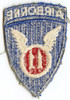 WWII US Army 11th Airborne Shoulder Patch with Integral Tab in Olive Drab Twill