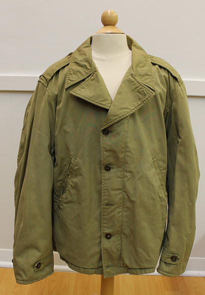 WWII M-41 Field Jacket as worn by Signal Officers with Signal Corps Insignia Painted on Back