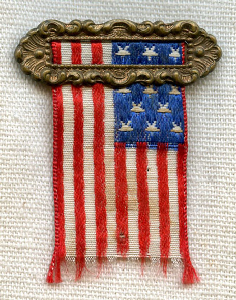 Early 20th C. US Flag Patriotic Ribbon Pin by Ehrman Manufacturing Co.