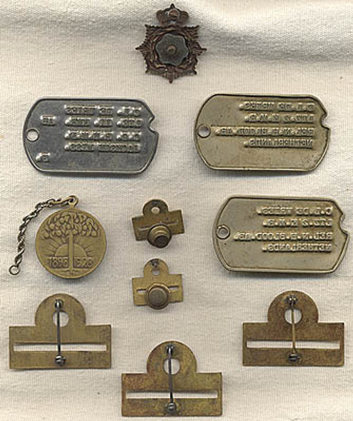 Insignia and Dog Tags of Lt. C.L. De Vries of the Netherlands Marine Force