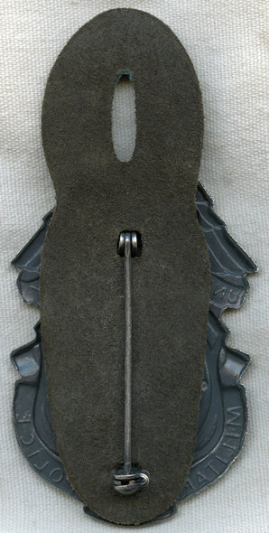 1970s US Army Military Police (MP) Badge on Issue Leather Hanger Numbered G5401