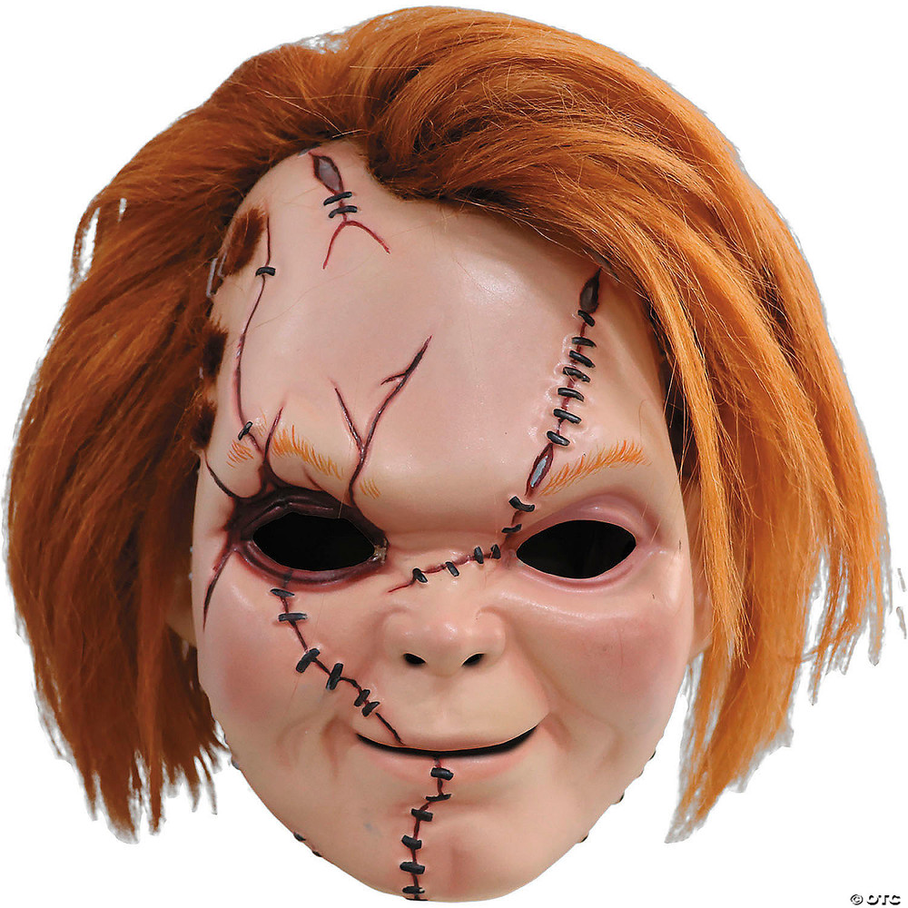 Curse of Chucky scarred plastic Halloween mask with orange hair, stitched scars, and black eye openings on white background.
