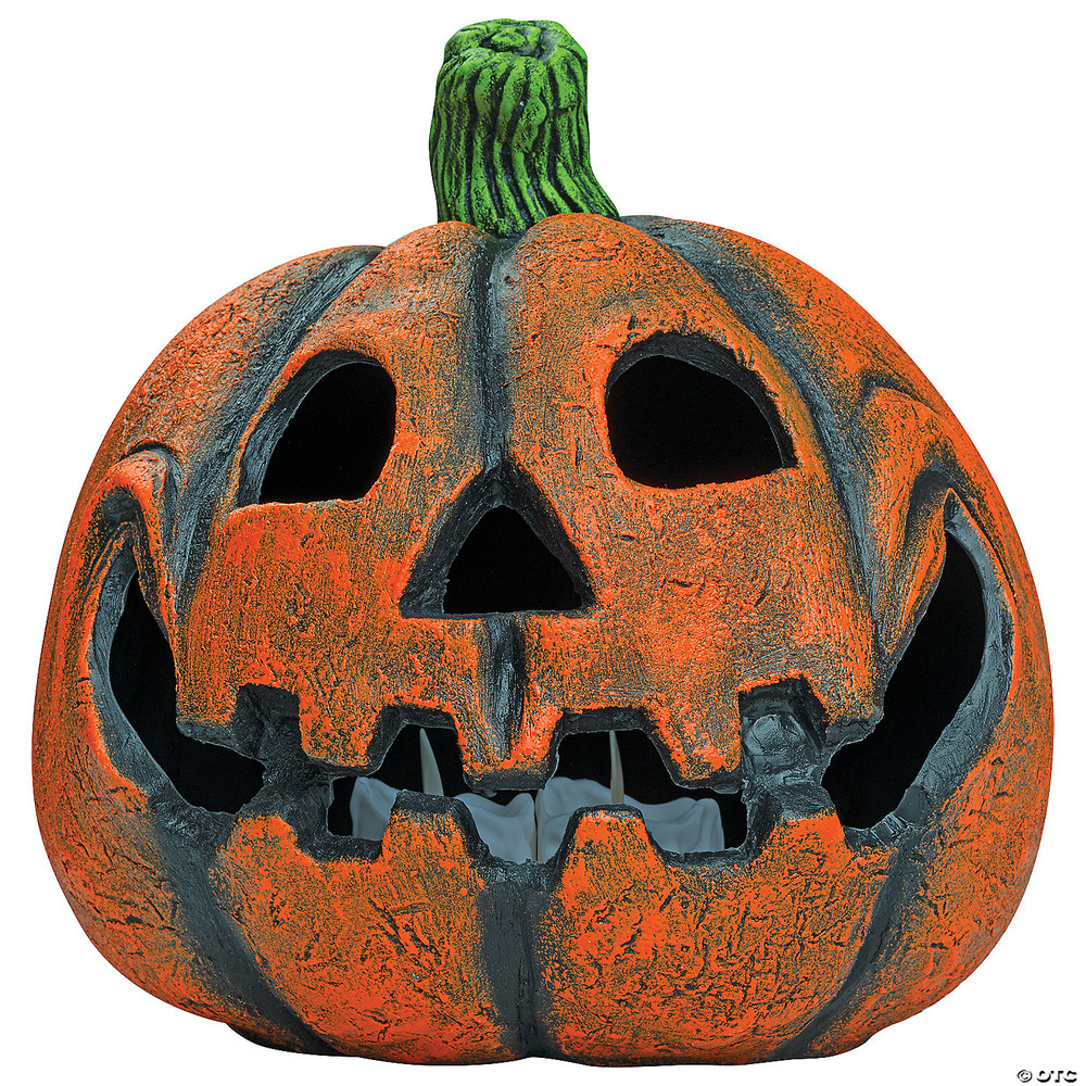 Orange resin jack-o-lantern decoration with carved triangular eyes, jagged teeth, and green stem, approximately 9 inches t…