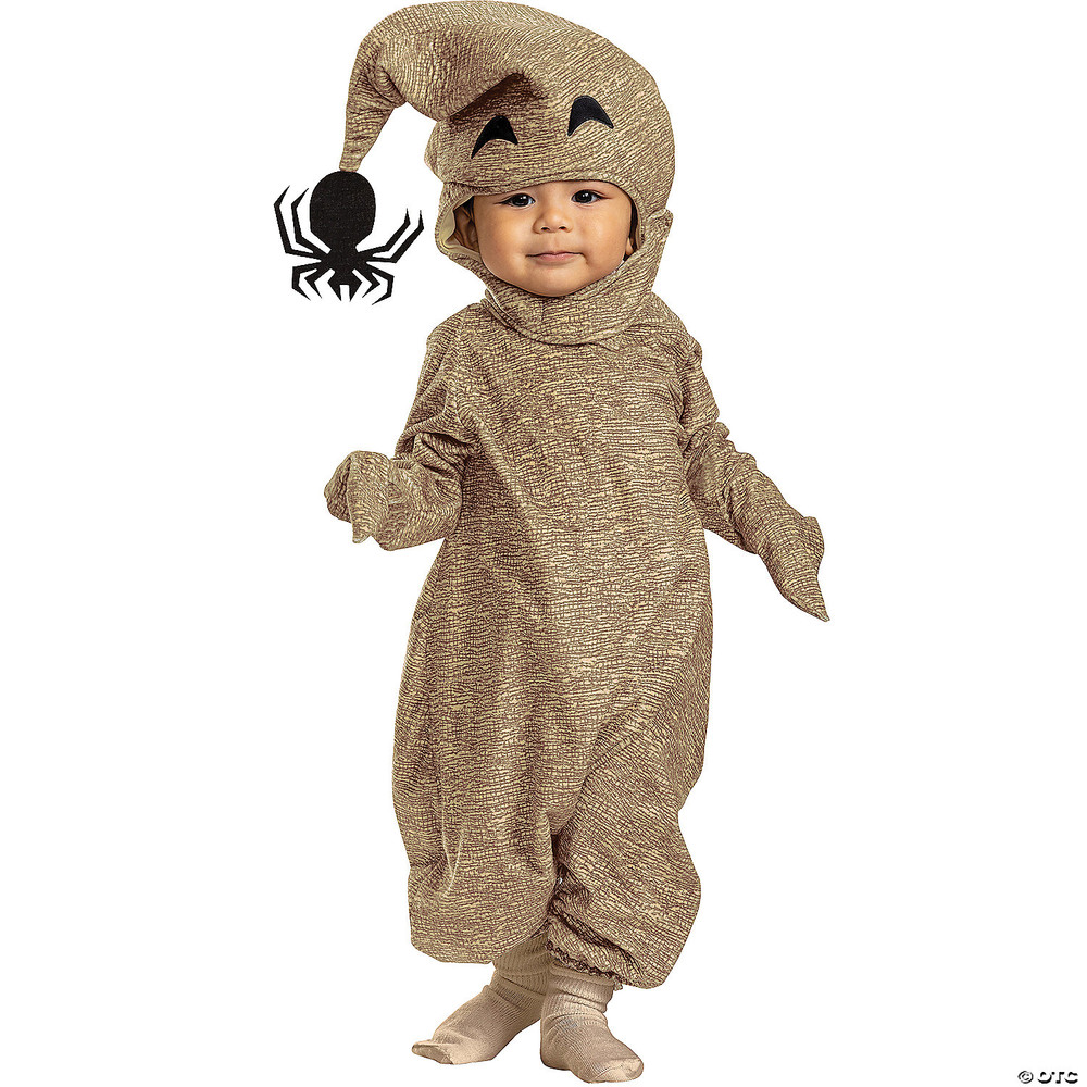 Baby wearing tan burlap-textured Oogie Boogie romper costume with jack-o-lantern face hat and black spider accent.