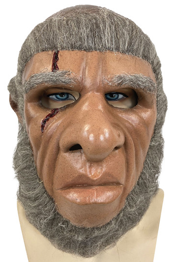 Latex ape-like costume mask with gray hair, blue eyes, and a bloody gash detail on the forehead, displayed on a mannequin…