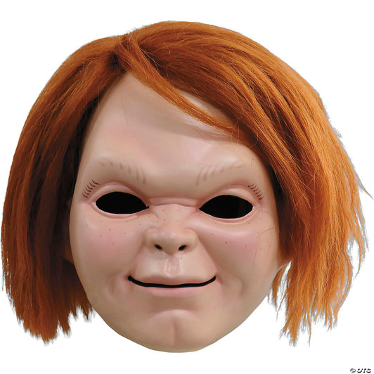 Plastic Chucky Halloween mask with smiling doll face, freckles, and attached shoulder-length orange hair, shown against wh…